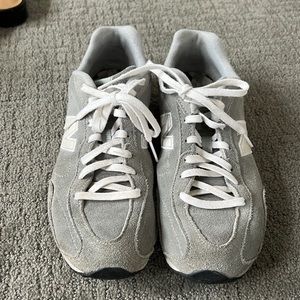 Gray suede New Balance tennis shoes